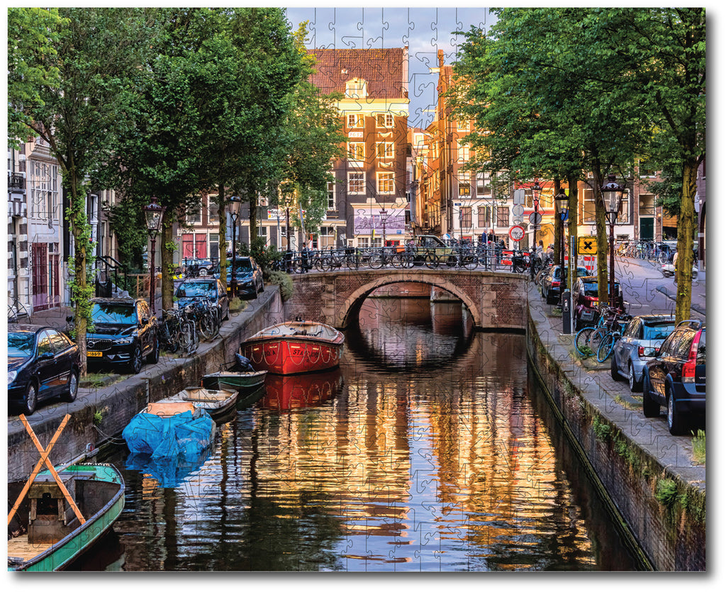 Starz Puzzles: Noriko Buckles "A Red Boat on Canel at Sunset"